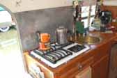 Photo of unique brass round kitchen sink in 1949 Silver Streak Clipper Trailer